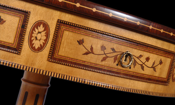 Detail of marquetry artwork of que queen D. Maria rotative round table