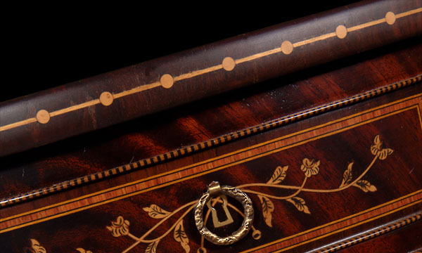 Detail of the inlaid artwork of exotic woods of the royal rotative round table, from Queen D. Maria